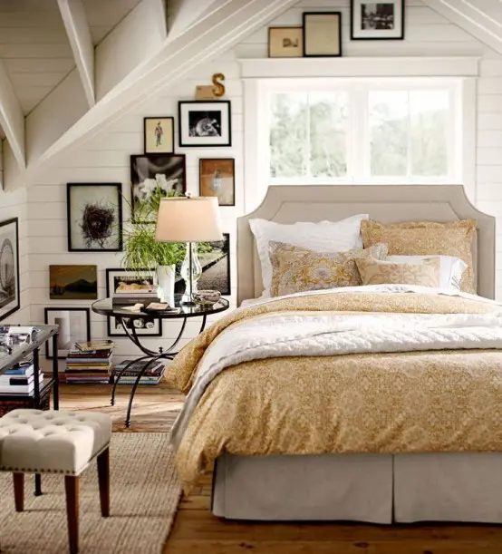 a farmhouse bedroom in white and neutrals, with a gallery wall and refined furniture 