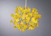 a fantastic mustard-colored flower chandelier will make a statement in any space with its color and shape