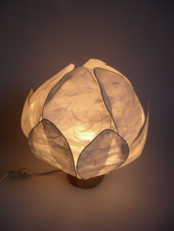 a small and simple neutral flower-shaped lamp will bring some peaceful deem and a natural feel to your space