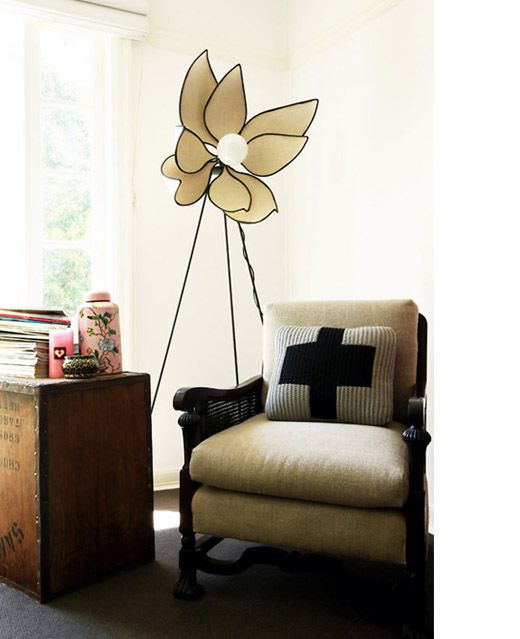 A large flower shaped floor lamp will bring an unusual feel to your space and will make it look cool