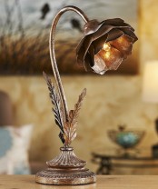 a metal flower-shaped table lamp looks industrial and vintage, with a creative and really unusual look
