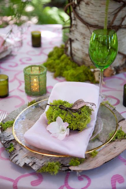 green moss, green glasses and candleholders paired with wood slices, birch bark for a stylish woodland Thanksgiving tablescape