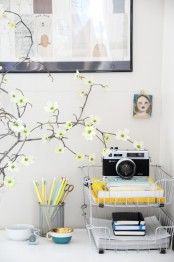 blooming branches in a vase will make your home office flourishing and very fresh