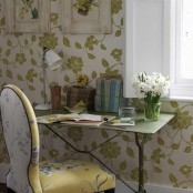 white and green botanical wallpaper and a floral print chair for a chic spring-like look in the home office