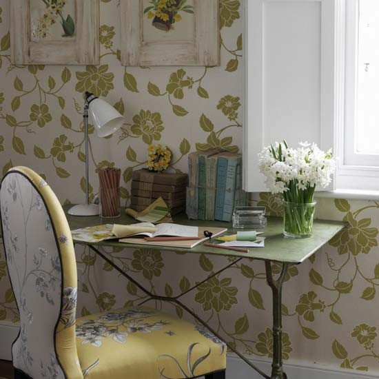 White and green botanical wallpaper and a floral print chair for a chic spring like look in the home office
