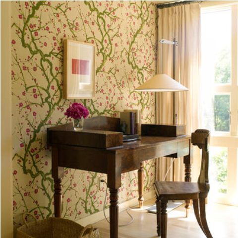 a bright green and pink floral print wall as a cool spring statement and a girlish touch to the office