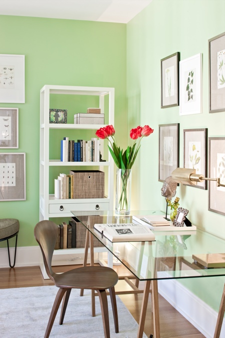 bright green walls and some fresh tulips make the space feel like spring and make it welcoming and bright