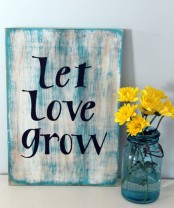 a shabby chic blue spring sign with black letters is a lovely idea for a touch of rustic in your space