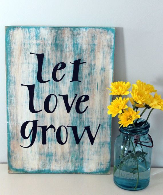 A shabby chic blue spring sign with black letters is a lovely idea for a touch of rustic in your space