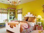 a super bright and whimsical kid’s room with mustard walls, a carved bed with colorful bedding, a storage unit, colorful textiles and curtains