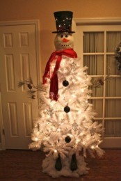 a snowman Christmas tree – a white tree with a snowman head, a tall hat, lights and a red scarf is a lovely idea