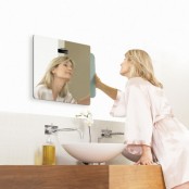 a smart mirror with an additional screen is a cool idea for those who love hi-tech and want to have screens everywhere, even in the bathroom