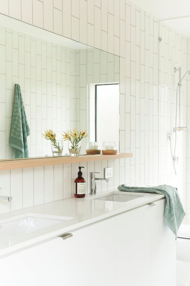 A large mirror with a shelf for storage is a cool idea for a contemporary bathroom   you get a large mirror, a lot of storage space and no bulky pieces
