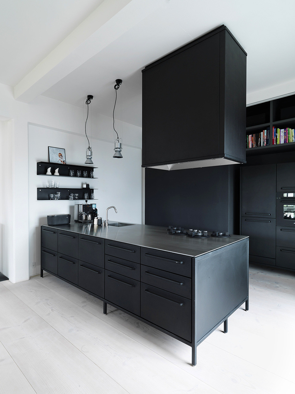 even a kitchen island with a cooking hood above it are all black