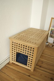 a long IKEA Hol table with a pet bed inside – let your pet sleep inside to feel safe and hidden