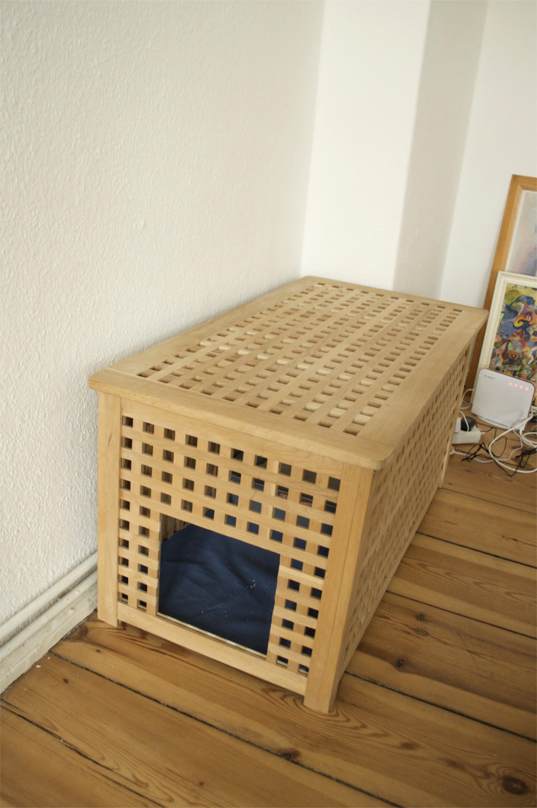 A long IKEA Hol table with a pet bed inside   let your pet sleep inside to feel safe and hidden