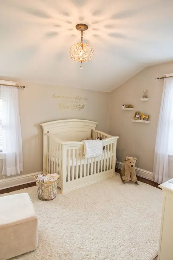 a neutral vintage nursery with elegant furniture, open shelves, printed bedding and neutral toys to match the space