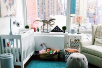 a gender neutral nursery with a view, bold printed and colorful textiles, rather neutral furniture, colorful toys is a cool idea