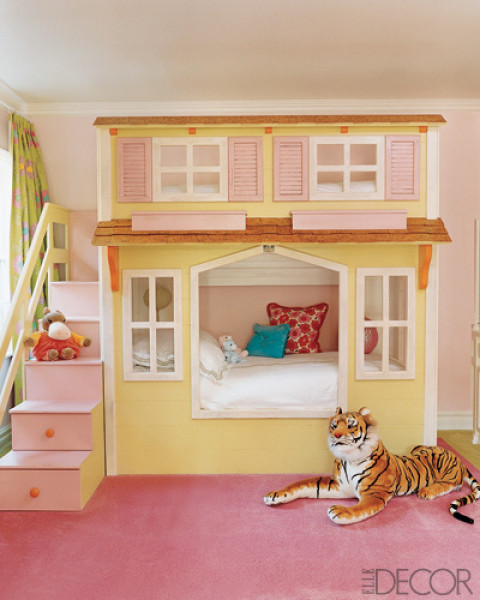 a colorful girl's room with a unique house-shaped bed with a storage ladder, colorful pillows and toys is a fun and cute space