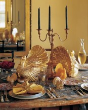 gold turkey figurines, gold candleholders, gold cutlery will make your Thanksgiving tablescape refined, chic and vintage