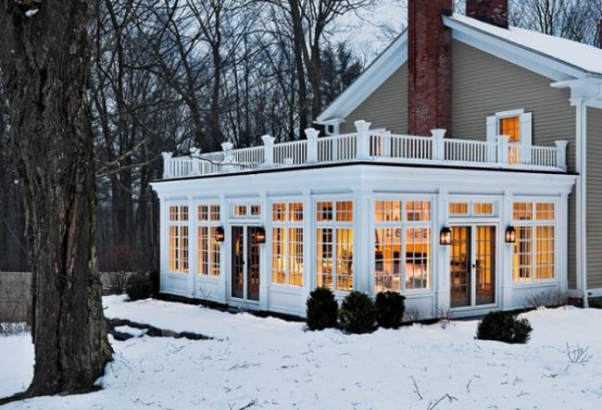 Beautiful sunroom with a deck on it. Perfect for any season.