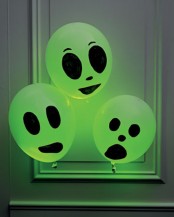 bold neon balloons with Halloween scary faces are amazing to style any Halloween space