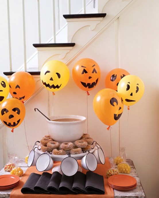 bold orange Halloween balloons as jack-o-lanterns are a great decoration that can be easily repeated