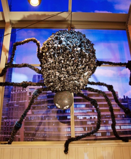 a large black paper spider with long legs can be easily DIYed for a Halloween party