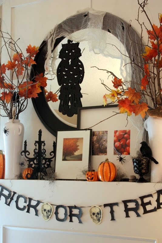 To add a contemporary touch to your Halloween mantelscape put a bunch of modern picture frames with gorgeous photos of autumn there.