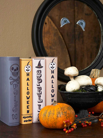 Wrap some of your books with heavy-duty brochure paper. Attach your own text and Halloween embellishments on them.