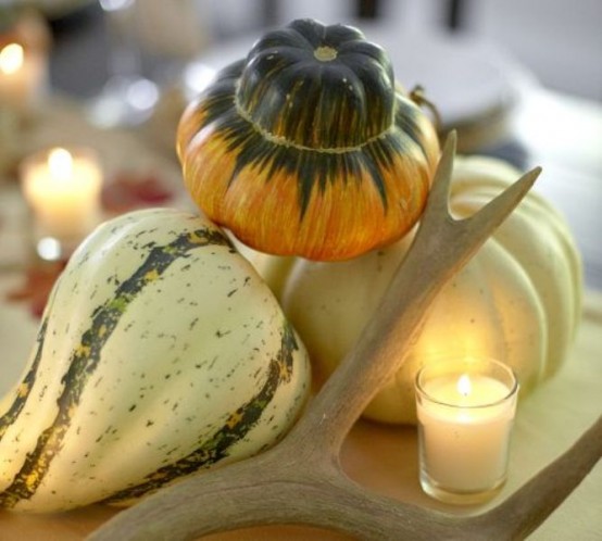 neutral pumpkins and gourds, candles and antlers for decorating for fall or Thanksgiving - a nice centerpiece or just decoration