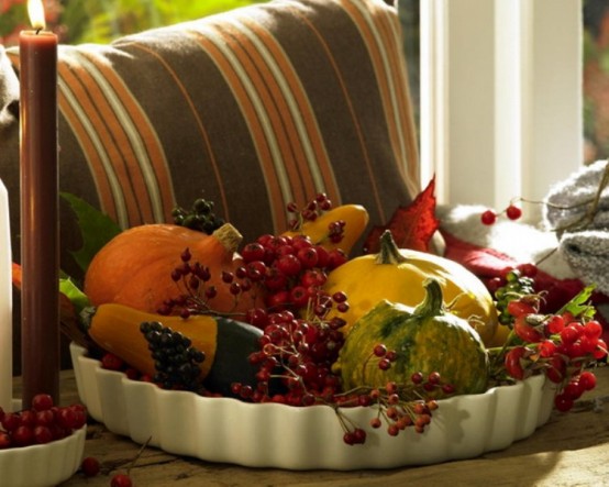 a tray with faux veggies and berries is a lovely Thanksgiving centerpiece of