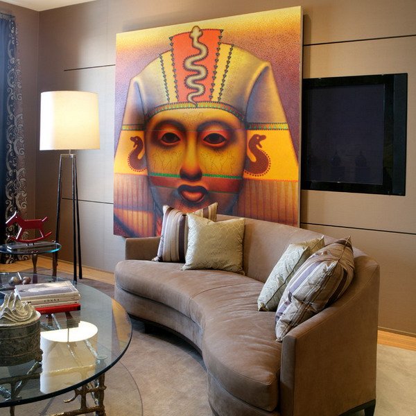 A TV on the wall hidden with a large Egypt inspired panel for a unique and quirky look in the living room