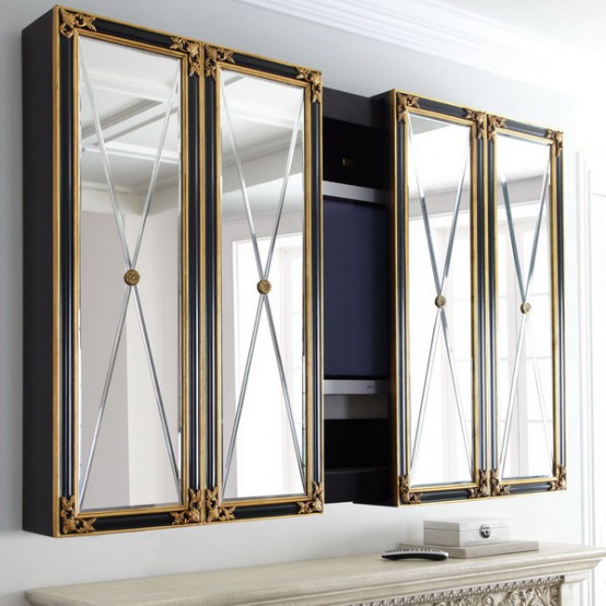 a TV on the wall with a mirror box around it, with refined and chic doors with detailing is a super cool and catchy idea