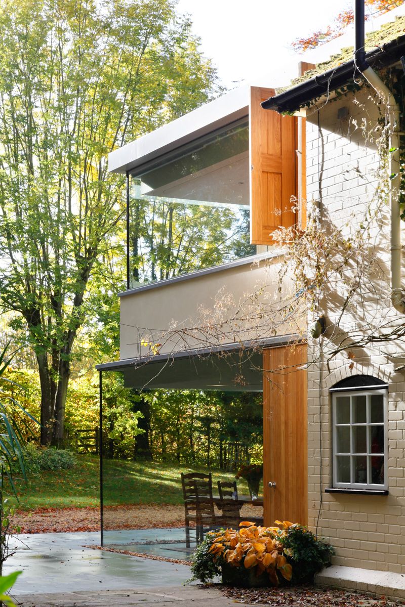 Historical english cottage with a glazed cantilevered extension  3