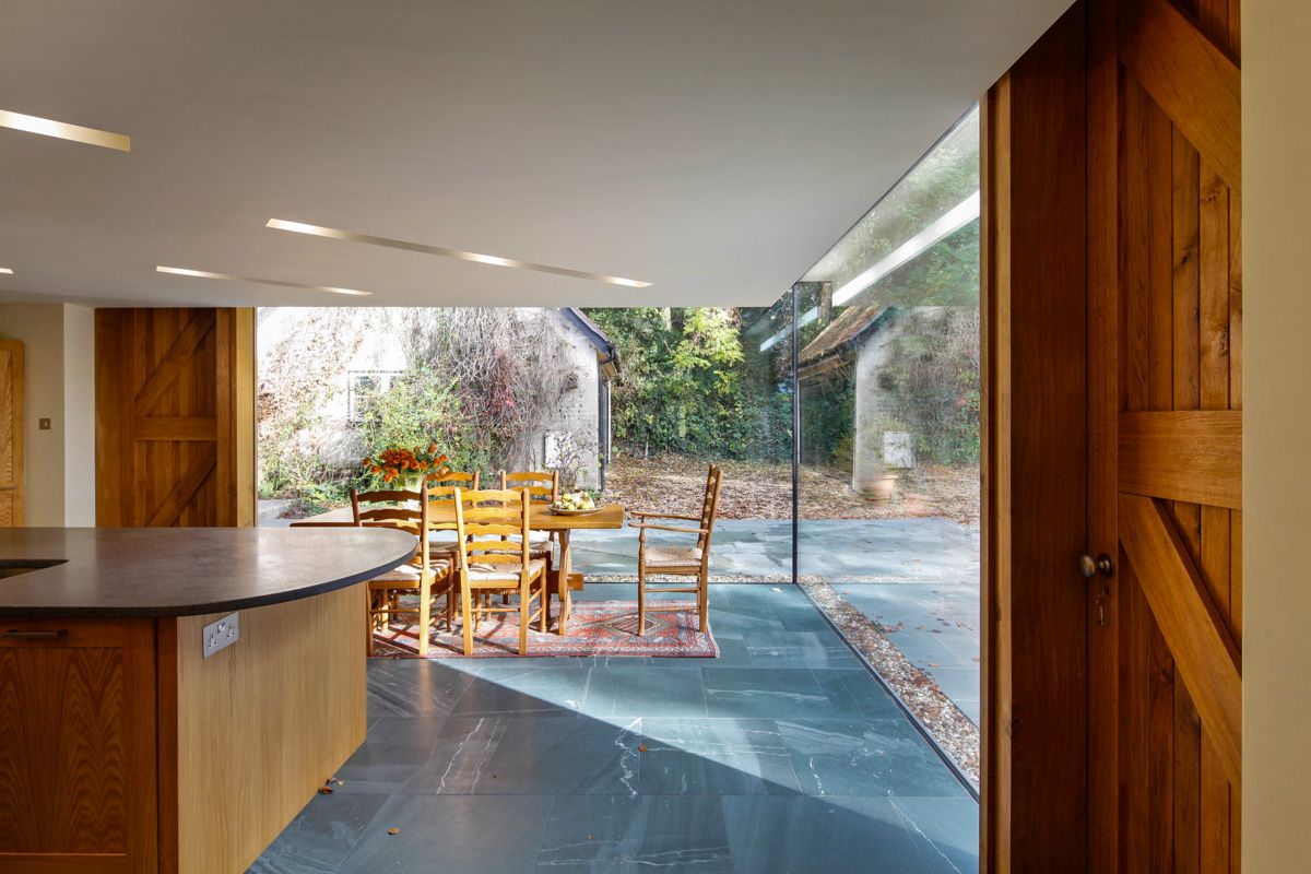 Historical english cottage with a glazed cantilevered extension  4