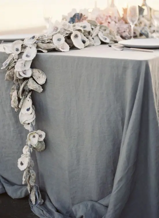 A seashell table runner will highlight a coastal tablescape or a beach inspired one