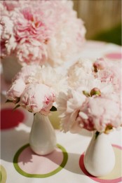 white bud vases with light pink peonies can be placed here and there as decorations, centerpieces and they will bring a cool aroma