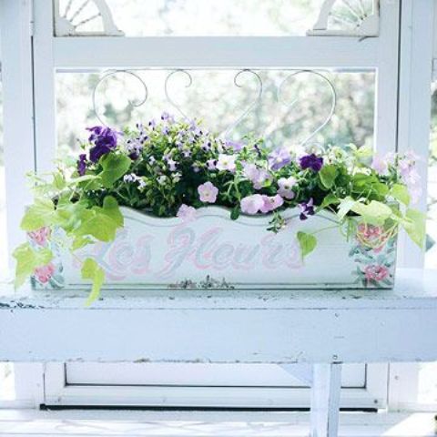 a vintage painted windowsill planter with summer blooms will decorate your window both indoors and outdoors