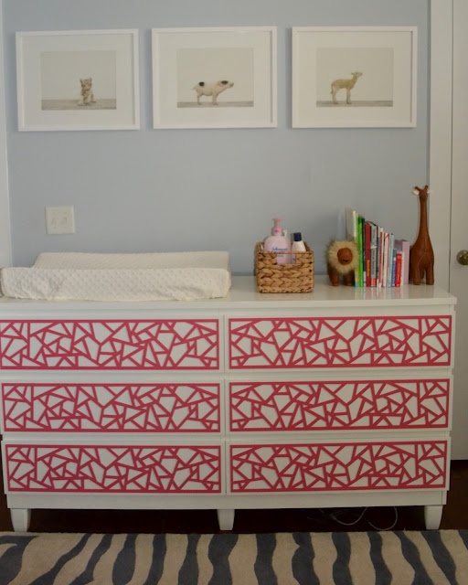 an IKEA Malm dresser hacked with red geometric panels for a touch of color i the nursery