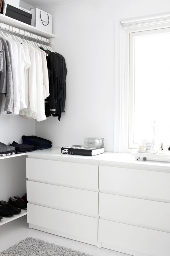 a Nordic closet done with open shelving, racks and IKEA Malm dressers