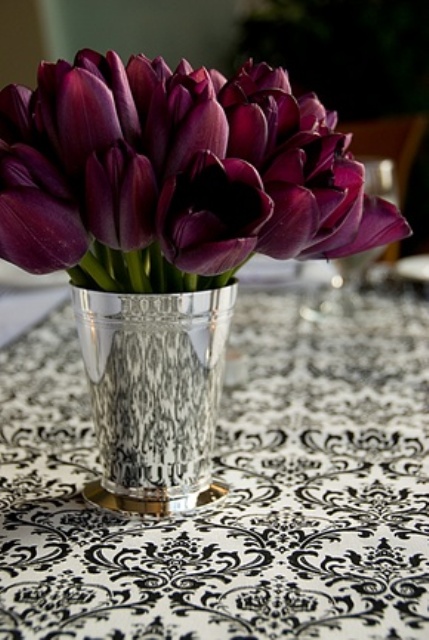 a polished mini bucket with deep purple tulips is a bold and refined spring centerpiece or decoration