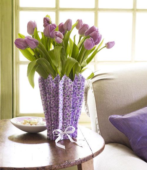 Purple tulips in a vase covered with a purple paper cover is a bold vintage inspired spring decoration