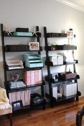 leaning black open shelving units are great for storing various stuff, they don’t look bulky and are comfortable in using