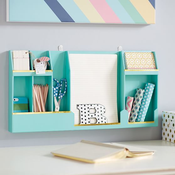 A colorful wall mounted storage unit with open departments is an ultimate choice for a modern home office