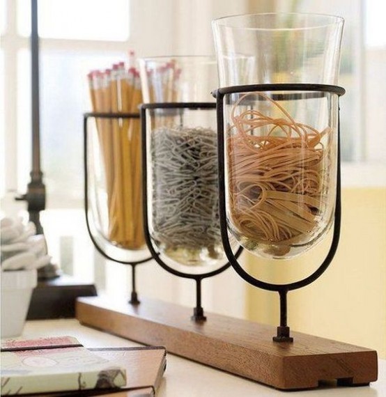 a wooden shelf with glass jars attached - these jars may be used for organizing anything you want