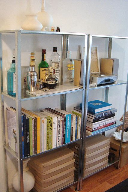 in your living room IKEA Hyllis shelves can also accommodate a home bar if needed