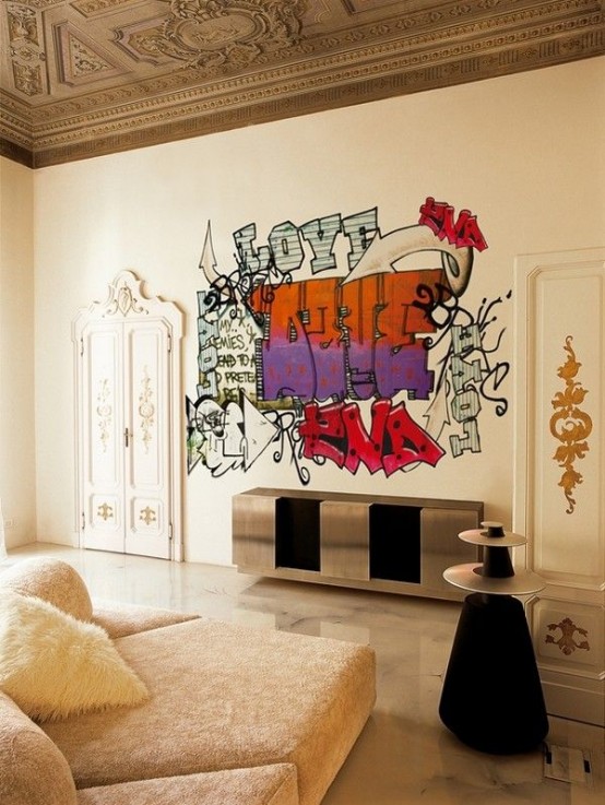 a beautiful contemporary living room with a stained molded ceiling, neutral furniture, a glam metallic credenza and a bold graffiti that wows