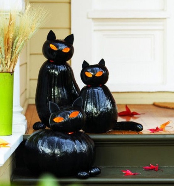 Guests and costumed kids will ascend the stairs with trepidation, unsure if they will get a trick or a treat if you decorate your porch with such creepy black cats.