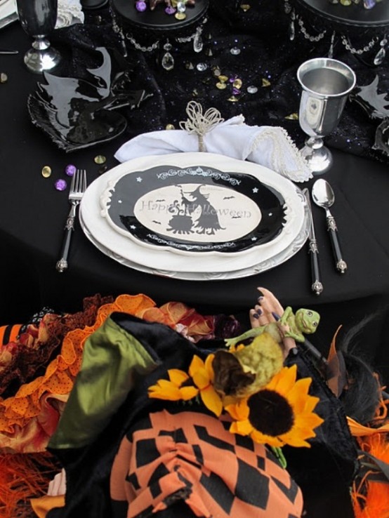 Black and white tableware always looks sophisticated especially in a dark Halloween table setting.